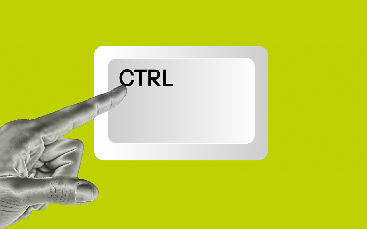 eine einzelne CTRL-Taste auf knallig gelbgrünen Grund, von links zeigt ein schwarz-weißer Zeigefinger darauf